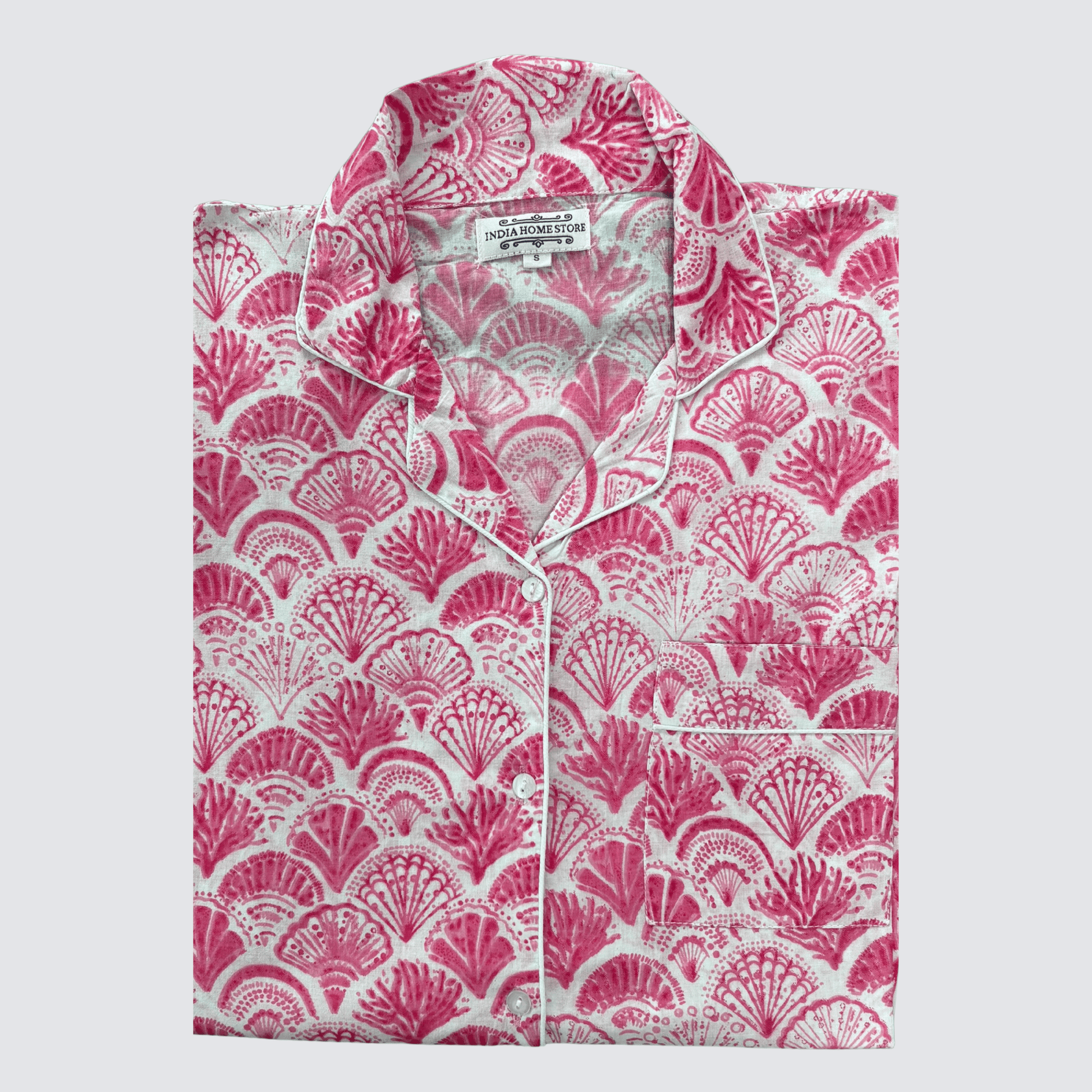 Bright pink shell print cotton pyjamas with long sleeves and trousers on white background