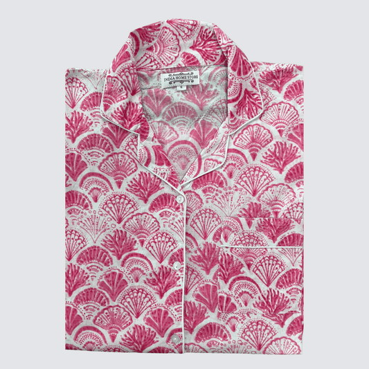 Bright pink shell print cotton pyjamas with long sleeves and trousers on white background